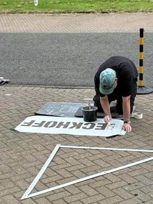 Painting company name on car park spaces