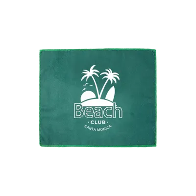 A green personalized beach towel with the white 'Beach Club - Santa Monica' logo and palm tree design displayed centrally.
