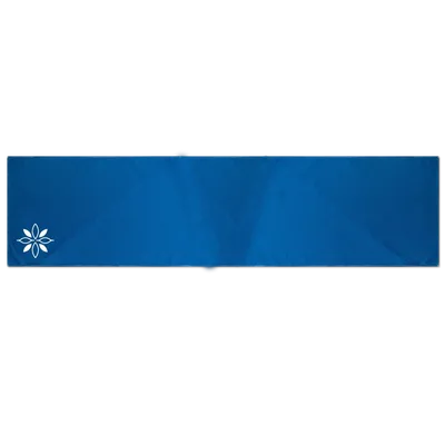 This image depicts a blue custom beach towel with a single white flower design on the lower right corner, representing the option of personalized beach towels.